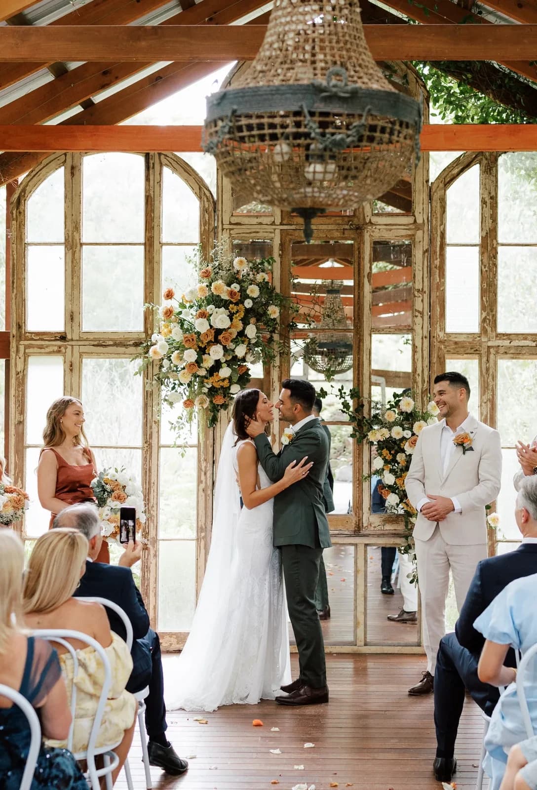 The ceremony in the timber bush chapel, seen from behind the seated guests