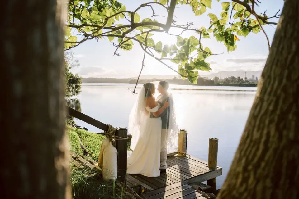 A couple by the water at golden hour — an example photo from a real wedding, uploaded to a Memories gallery