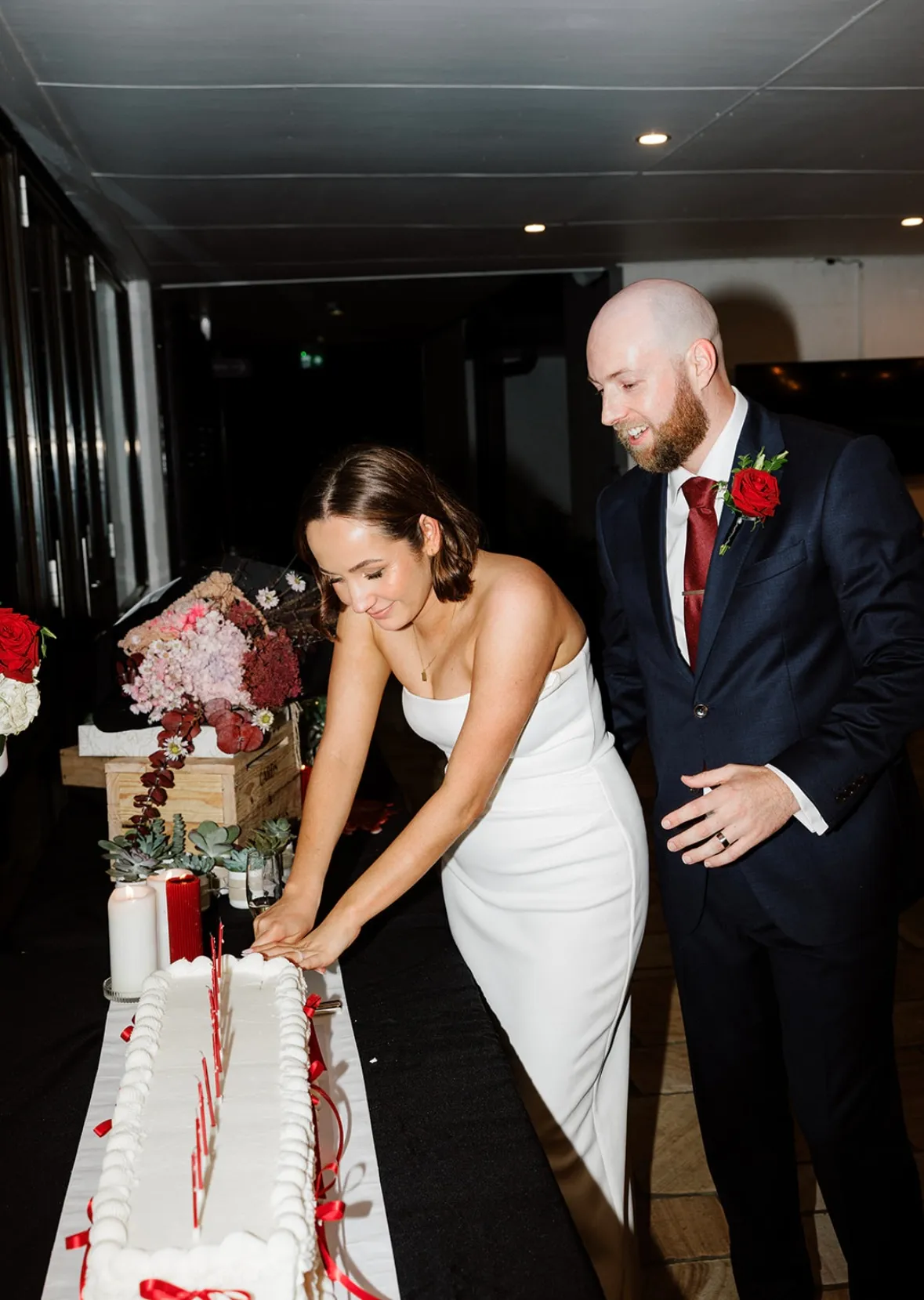 Bride and groom cutting cake at Penrith venue