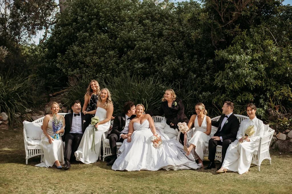 Bridal party seated on coastal garden chairs at The Cove Jervis Bay